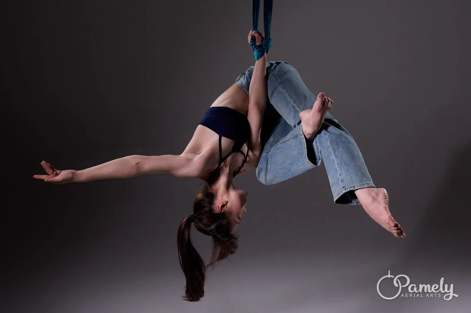 Pamely horizontal in an aerial hammock