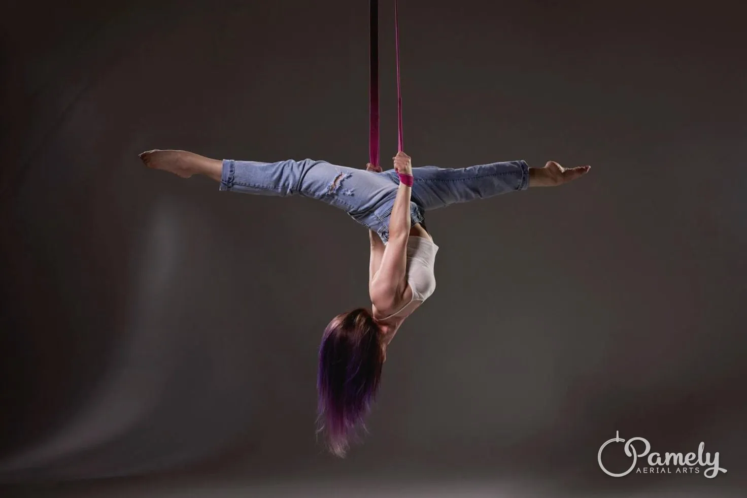 Pamely stretched out on aerial straps