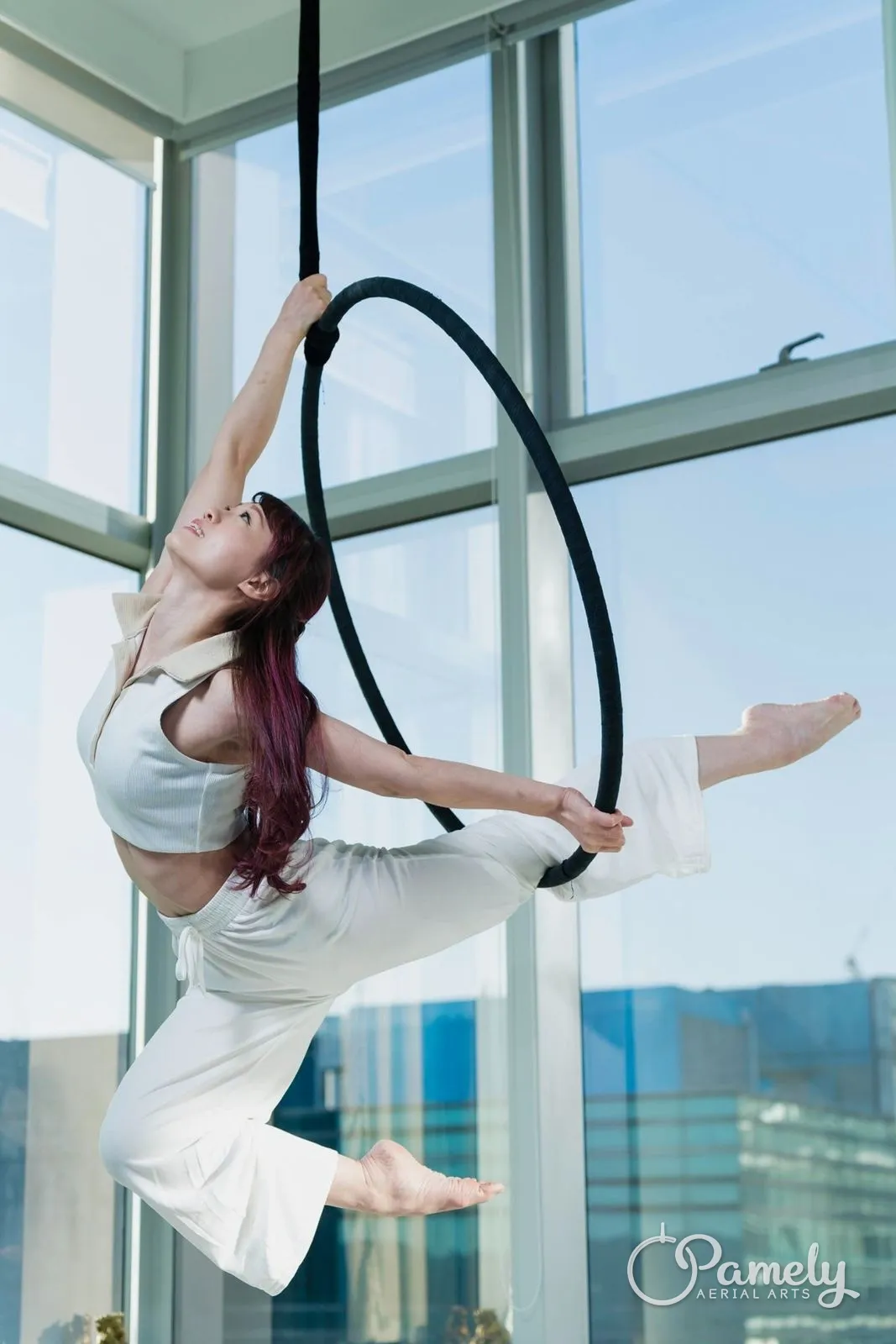 Pamely in a hoop beside a bright window