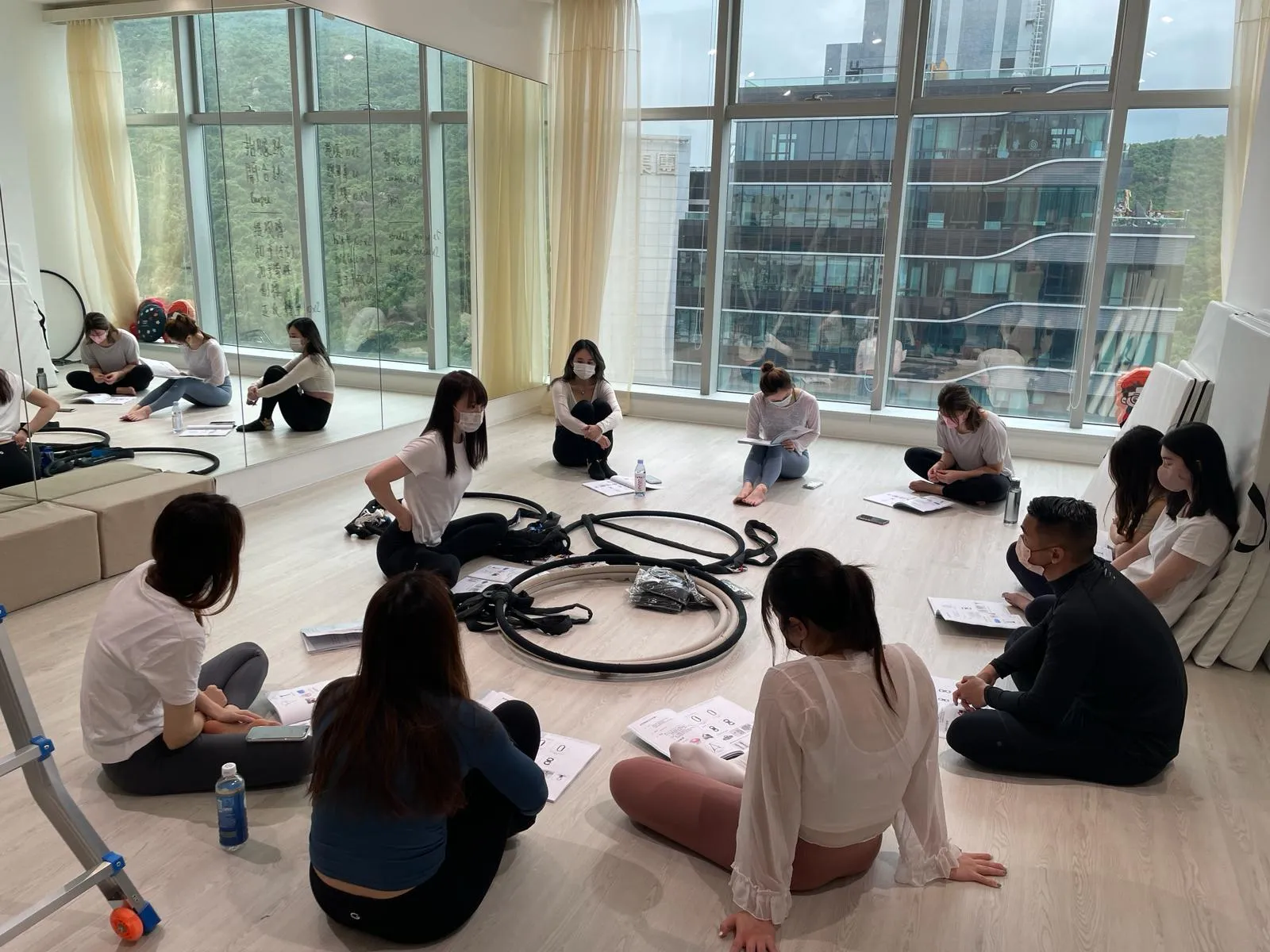 Trainees sitting in a circle during a teacher training session